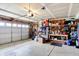 Spacious garage featuring ample storage racks, a workbench, and an automatic door at 18258 Rickety Dr, Westfield, IN 46074