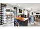 Bright kitchen with access to outdoor patio, complete with island and breakfast bar seating at 18258 Rickety Dr, Westfield, IN 46074
