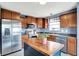 Well-equipped kitchen featuring stainless steel appliances, wooden cabinetry, and a functional center island at 18258 Rickety Dr, Westfield, IN 46074