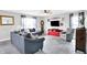 Comfortable living room with neutral walls, stylish furniture, and plenty of natural light from large windows at 18258 Rickety Dr, Westfield, IN 46074