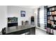 Functional home office with a sleek desk, aquarium, and stylish shelving, offering ample storage at 18258 Rickety Dr, Westfield, IN 46074