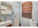 Cozy bathroom featuring a vanity with a white vessel sink, a toilet, and a shower and bath combination at 1867 Barth Ave, Indianapolis, IN 46203