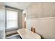 Bathroom featuring a clawfoot tub and wainscotting at 1867 Barth Ave, Indianapolis, IN 46203