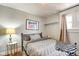 Cozy bedroom featuring light grey walls, modern decor, and a comfortable queen-sized bed at 1867 Barth Ave, Indianapolis, IN 46203
