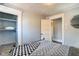 Bright bedroom boasting a closet with shelving, fresh paint and modern flooring at 1867 Barth Ave, Indianapolis, IN 46203