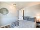 Bedroom featuring wood-look floors, light grey walls, and a cozy queen bed at 1867 Barth Ave, Indianapolis, IN 46203