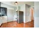 This kitchen features stainless steel appliances, warm wood flooring and access to an exterior door at 1867 Barth Ave, Indianapolis, IN 46203
