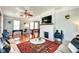 Spacious living room featuring a brick fireplace, a large screen television and a comfortable seating area at 1867 Barth Ave, Indianapolis, IN 46203