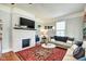 Comfortable living room with a decorative fireplace, plush seating, and ample natural light at 1867 Barth Ave, Indianapolis, IN 46203