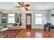 Open-concept living area with hardwood floors, plenty of natural light, and a ceiling fan at 1867 Barth Ave, Indianapolis, IN 46203