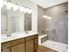 Bathroom featuring a large tiled walk-in shower, hardwood floors, and double sink vanity at 19725 Highclere Lane, Sheridan, IN 46069
