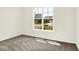 Carpeted bedroom featuring a window with a view of the neighborhood at 19725 Highclere Lane, Sheridan, IN 46069