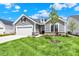 Charming single-Gathering home boasting a well-manicured lawn and a two-car garage at 19725 Highclere Lane, Sheridan, IN 46069