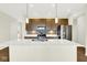 Contemporary kitchen with a spacious island, stainless steel appliances, and sleek countertops for modern cooking at 19725 Highclere Lane, Sheridan, IN 46069