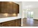 Gourmet kitchen with modern cabinets, stainless appliances, and access to a bright dining area with sliding glass doors at 19725 Highclere Lane, Sheridan, IN 46069