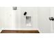 Laundry hookups on a white wall with hardwood floors at 19725 Highclere Lane, Sheridan, IN 46069