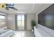 Spacious main bedroom with a ceiling fan, large windows with a view, and ample closet space at 19725 Highclere Lane, Sheridan, IN 46069