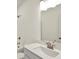 Modern bathroom with a large mirror, updated sink, shower with tub, and ample lighting at 19762 Highclere Lane, Sheridan, IN 46069