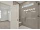 This bathroom features a shower with gray tile, a built-in seat, and a window at 19762 Highclere Lane, Sheridan, IN 46069
