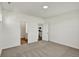 This carpeted bedroom features two doors, one to the bathroom and one to the kitchen at 19762 Highclere Lane, Sheridan, IN 46069