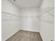 Walk-in closet with carpeted floor and white shelving at 19762 Highclere Lane, Sheridan, IN 46069