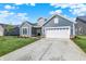 Beautiful single-Gathering home with blue siding, white garage door, and spacious concrete driveway at 19762 Highclere Lane, Sheridan, IN 46069