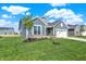 Charming single-Gathering home with blue siding, stone accents, manicured lawn, and inviting curb appeal at 19762 Highclere Lane, Sheridan, IN 46069
