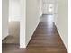 Hallway with Hardwood flooring that transitions from Hardwood to carpet in the room on the left at 19762 Highclere Lane, Sheridan, IN 46069