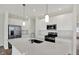 Modern kitchen featuring stainless steel appliances, ample counter space, and white cabinets at 19762 Highclere Lane, Sheridan, IN 46069