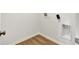Laundry area with wood-look floors and washer/dryer hookups at 19762 Highclere Lane, Sheridan, IN 46069
