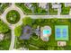 Aerial view of neighborhood amenities: swimming pool and tennis courts, with lush landscaping and neatly arranged parking at 2055 Mulsanne Dr, Zionsville, IN 46077