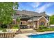 Gorgeous backyard with pool, patio, pergola, outdoor seating and professional landscaping at 2055 Mulsanne Dr, Zionsville, IN 46077