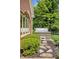 Backyard with a hot tub and a stone path nestled among lush landscaping at 2055 Mulsanne Dr, Zionsville, IN 46077