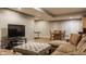 Basement with living area, dining table, and ping pong table with bright overhead lighting at 2055 Mulsanne Dr, Zionsville, IN 46077
