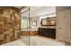 Luxury bathroom features a glass shower, jacuzzi, and a vanity with double sinks at 2055 Mulsanne Dr, Zionsville, IN 46077