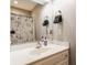 Simple bathroom featuring a vanity with a white sink and a shower with an artistic curtain at 2055 Mulsanne Dr, Zionsville, IN 46077