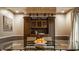 Elegant dining room with hardwood floors, coffered ceilings, and access to other rooms at 2055 Mulsanne Dr, Zionsville, IN 46077