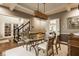 Elegant dining room with hardwood floors, coffered ceilings, and access to other rooms at 2055 Mulsanne Dr, Zionsville, IN 46077