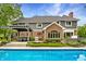 Stunning backyard featuring a well maintained pool and beautiful two-story home at 2055 Mulsanne Dr, Zionsville, IN 46077