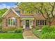 Classic brick home featuring a welcoming front entrance with decorative landscaping at 2055 Mulsanne Dr, Zionsville, IN 46077
