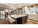 Open kitchen boasts stainless appliances, breakfast bar, and convenient flow to dining and living areas at 2055 Mulsanne Dr, Zionsville, IN 46077