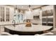This bright kitchen features stainless steel appliances, quartz countertops, and pendant lighting at 2055 Mulsanne Dr, Zionsville, IN 46077