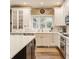 Bright eat-in kitchen features white cabinetry, stainless appliances, and quartz countertops at 2055 Mulsanne Dr, Zionsville, IN 46077