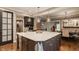 Gourmet kitchen features large island with seating, quartz countertops and stainless appliances at 2055 Mulsanne Dr, Zionsville, IN 46077