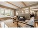 Cozy living room with a sectional sofa, area rug, and windows offering views of the outdoors at 2055 Mulsanne Dr, Zionsville, IN 46077