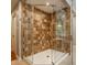 Tiled shower with glass enclosure, offering a sleek and modern bathroom design at 2055 Mulsanne Dr, Zionsville, IN 46077