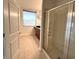 Bathroom featuring tiled floor and walk-in shower with glass door at 225 N New Jersey St # 46, Indianapolis, IN 46204