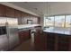 Modern kitchen featuring stainless steel appliances, granite countertops, wood cabinets and hardwood floors at 225 N New Jersey St # 46, Indianapolis, IN 46204