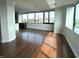 Bright living room featuring hardwood floors and lots of natural light with a cityscape view at 225 N New Jersey St # 46, Indianapolis, IN 46204