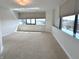 Bright living room with wall-to-wall carpet, large window offering natural light at 225 N New Jersey St # 46, Indianapolis, IN 46204